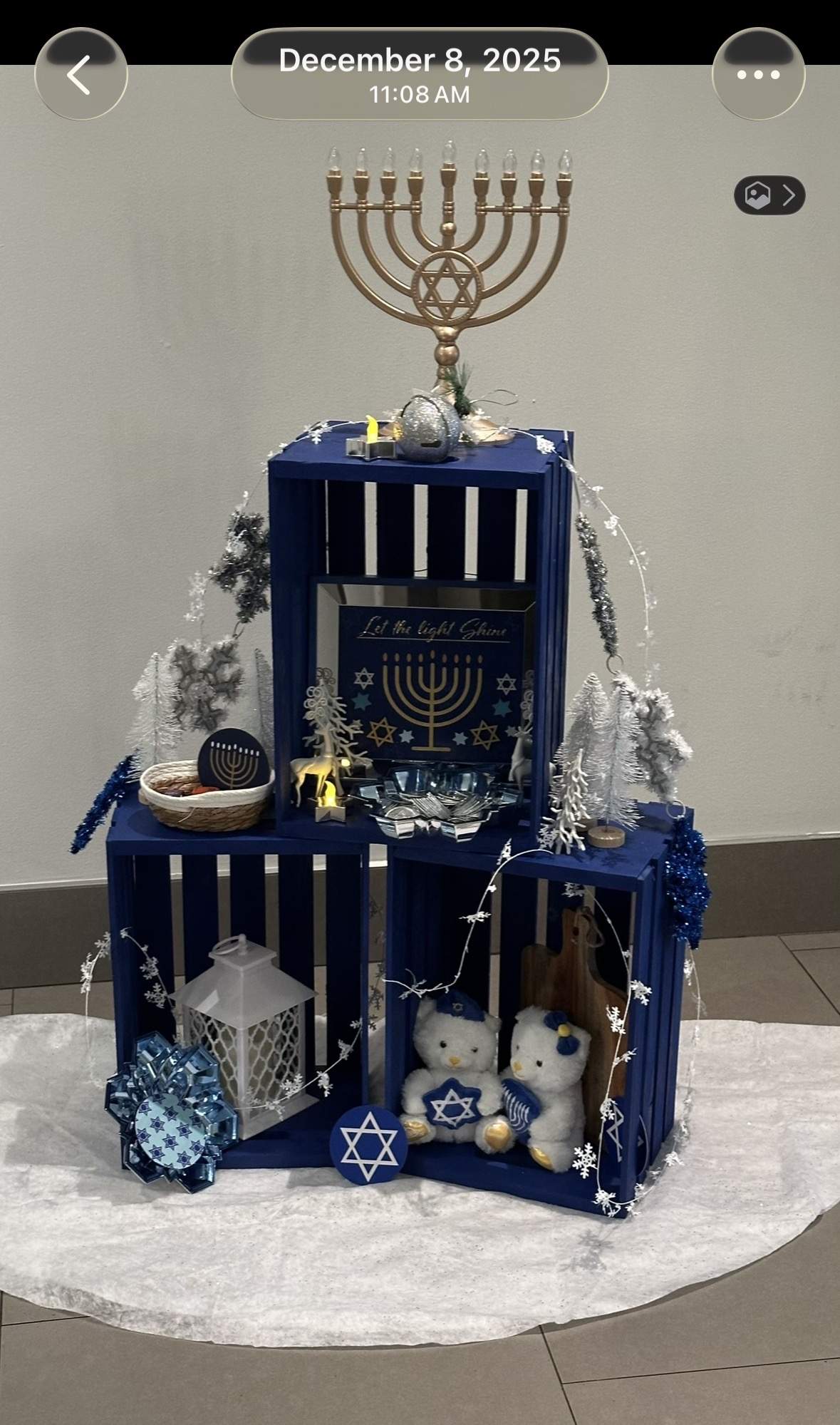 A large electric menorah and Star of David staged in the Goldtex lobby, December 2025 — the same lobby where the assault occurred.